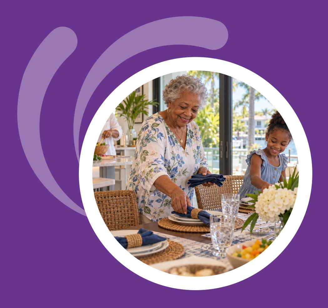 Older woman and young girl setting a table together in a bright Florida home