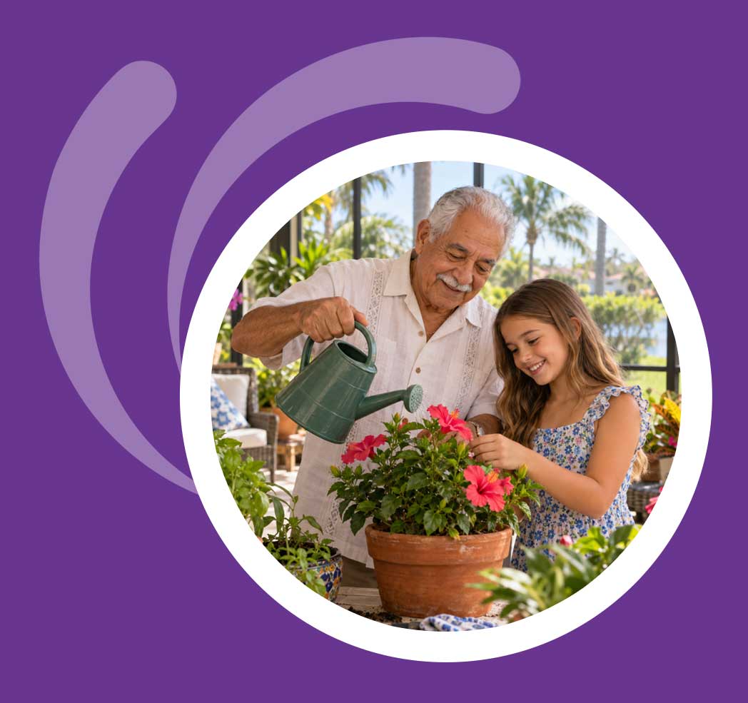 Florida grandfather teaching his granddaughter to care for plants on a lanai
